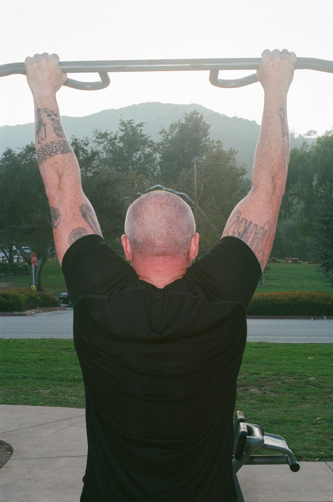 Merino Speed Short Sleeve T-Shirt in black, back view outdoors on a pull-up bar