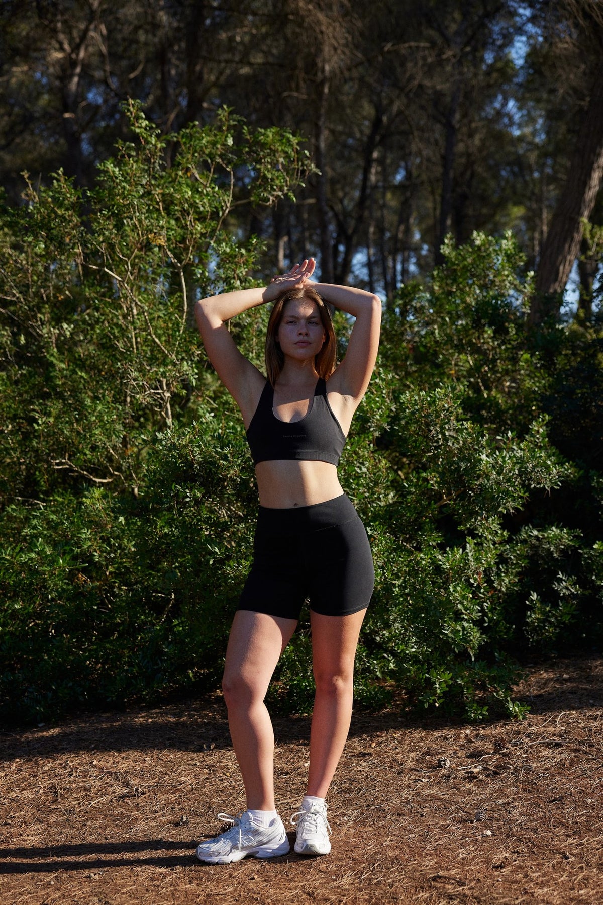 Flo organic cotton bike shorts in black, front view outdoors